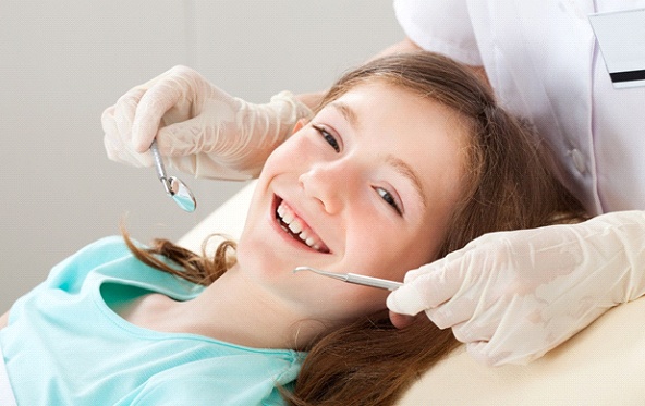 Girl receiving dental checkup in Fuquay-Varina
