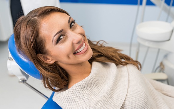Woman smiling during dental appointment
