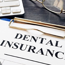 Dental insurance form on clipboard 