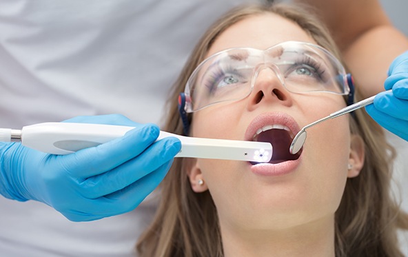 Dentist capturing smile photos using an intraoral camera