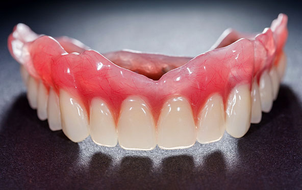 closeup of full dentures in Fuquay-Varina 