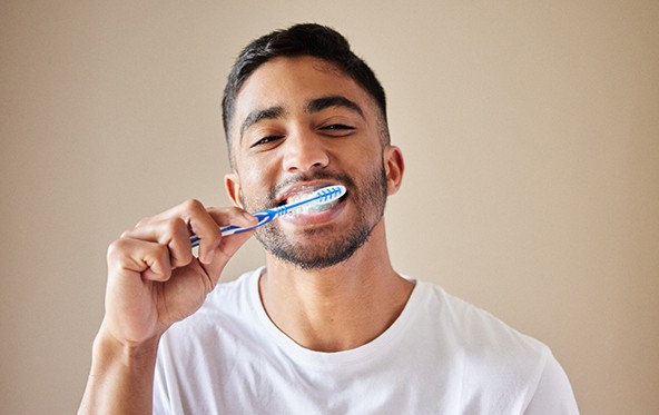 a person brushing their teeth