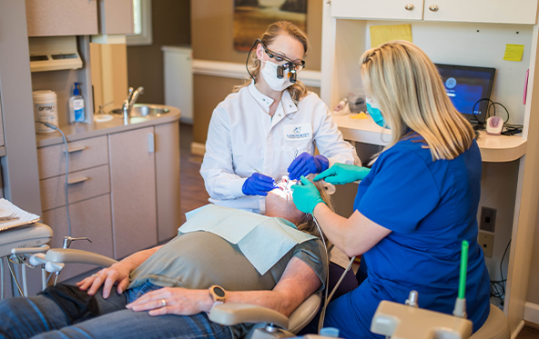 Dental patient relaxed during preventive dentistry checkups and teeth cleaning visit