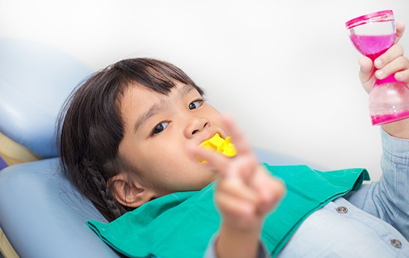 Child receiving fluoride treatment