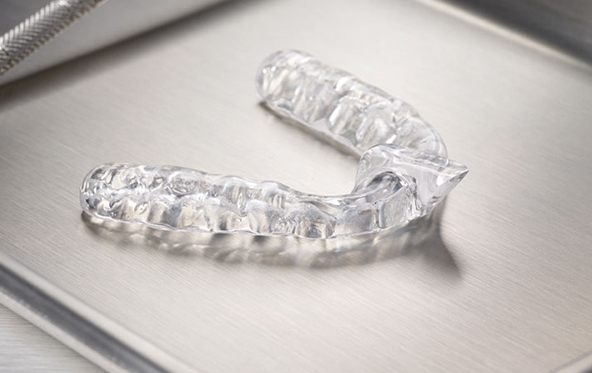 Clear nightguard for bruxism on metal tray