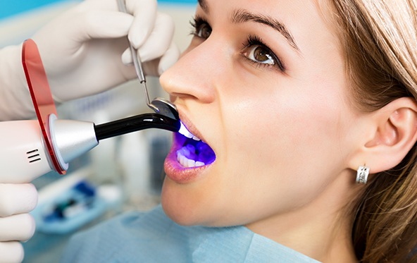 Patient receiving dental bonding treatment