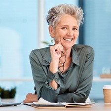 Woman smiling at her desk