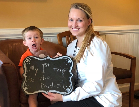 Doctor Langworthy and young patient smiling together