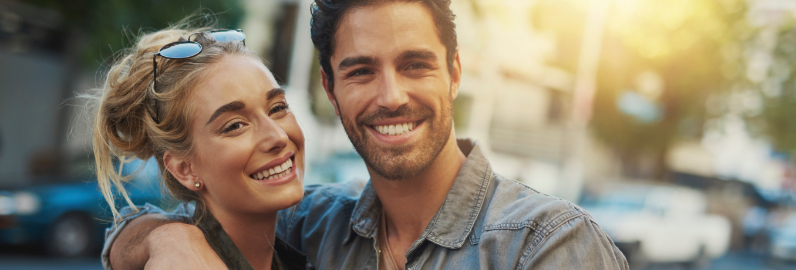 Man and woman with flawless smiles after cosmetic dentistry