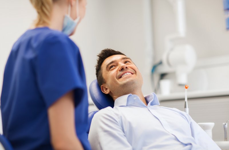 patient talking to their dentist